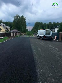 Фото | Укладка асфальтовой крошки при помощи асфальтоукладчика