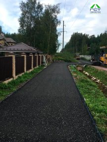 Фото | Укладка асфальтовой крошки при помощи асфальтоукладчика